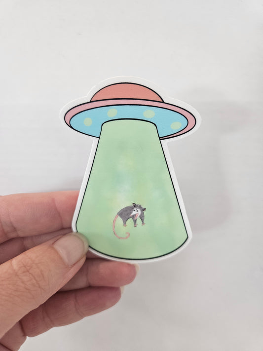 Opossum UFO Abduction Vinyl Sticker – 2″ × 2.87″ - Wanderland Art House