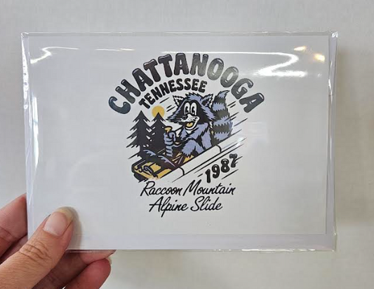 Raccoon Alpine Slide Greeting Card